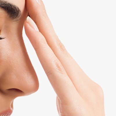 Woman touching her face